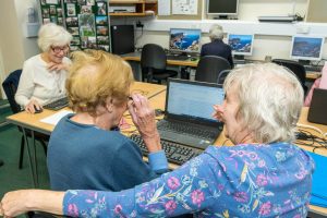 People using the computers at Hudson House, Reeth Information Centre